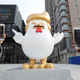 People take pictures with mobile phones of a sculpture of a rooster that local media say bears resemblance to U.S. President-elect Donald Trump, outside a shopping mall in Taiyuan, Shanxi province, China December 30, 2016. REUTERS/Jon Woo - RC18629233C0